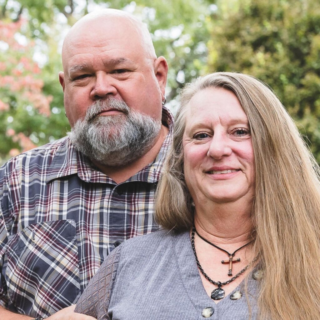 A man and woman standing next to each other.
